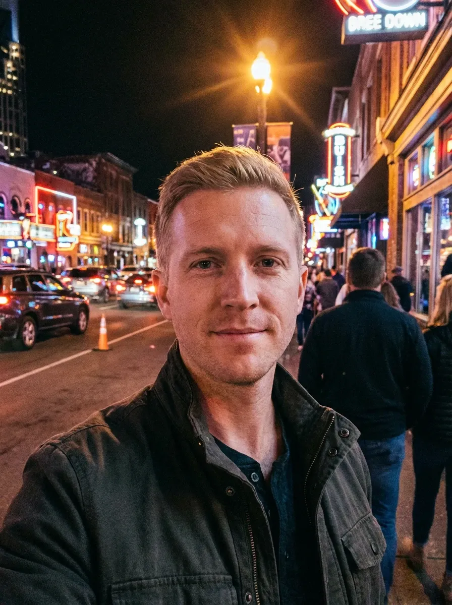 Original selfie input — man in a dark jacket on a night street